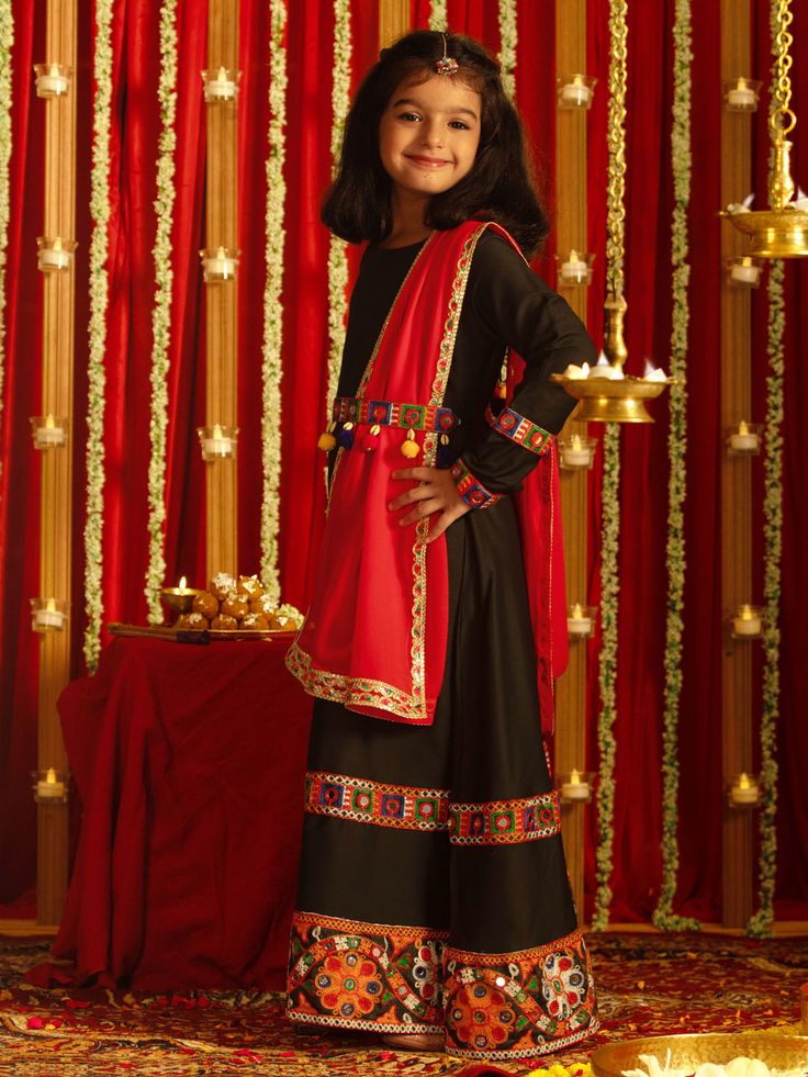 VASTRAMAY Boys' Cream Thread Worked Kurta Pyjama Set Available in various sizes, this set is designed to make your celebrations memorable. Crafted with high-quality materials, it offers comfort and style. Features Elegant Black Anarkali Kurta Vibrant Red Dupatta Perfect for Navratri Celebrations Comfortable and Stylish Specifications Color: Black (Kurta), Red (Dupatta) Material: [Fill in Material Here] Sizes Available: [Fill in Sizes Here] Care Instructions: [Fill in Care Instructions Here] Mate Red Sets With Dabka For Traditional Ceremonies, Traditional Red Sets With Dabka Detailing, Black Sharara For Eid Celebration, Bollywood Style Sets For Navratri Celebration, Red Traditional Wear With Dabka For Festivals, Traditional Black Sharara For Festive Occasions, Festive Anarkali Set For Traditional Ceremonies, Anarkali Sharara For Celebration During Navratri, Festive Anarkali Choli For Traditional Ceremonies