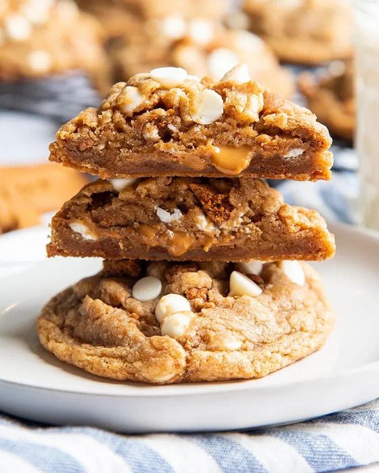 three cookies stacked on top of each other with marshmallows in the middle