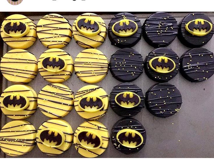 cupcakes decorated like batman's with yellow icing