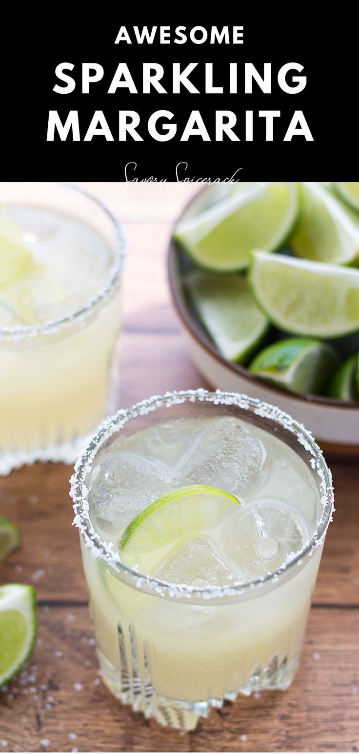 two margaritas sitting on top of a wooden table