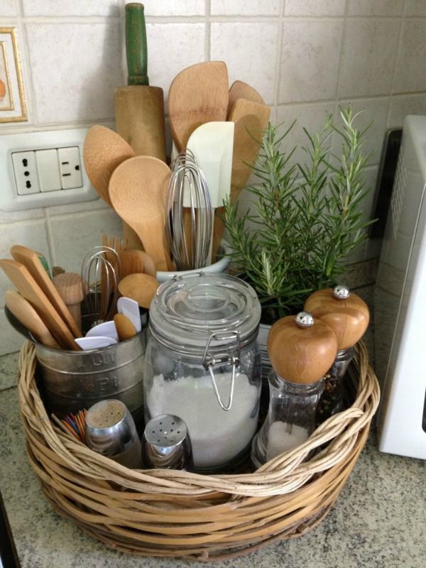 a basket filled with kitchen utensils on top of a counter