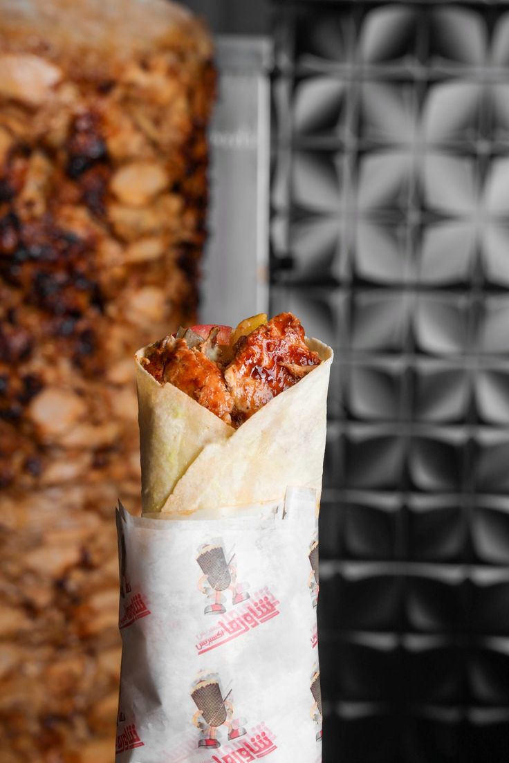 a wrapper filled with food sitting on top of a counter