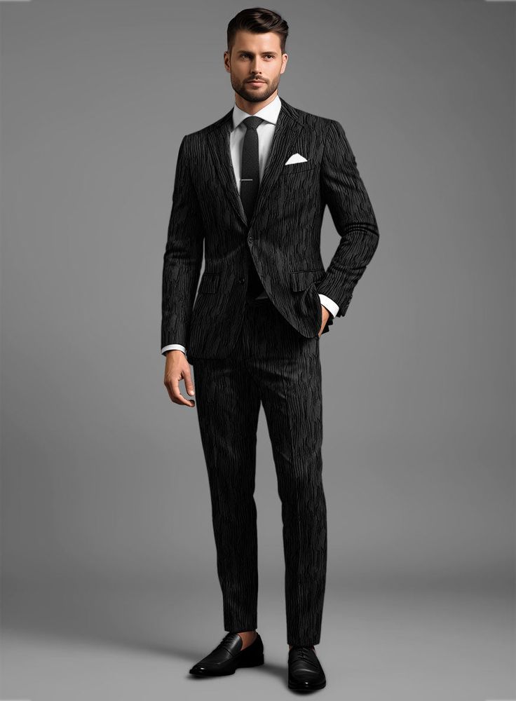 Jazz up your evening attire with our Italian Ramona Suit, infusing a touch of class into your ensemble. Handcrafted from pure polyester, this suit is the perfect fusion of comfort and unmatched style. The texturized black backdrop adds that extra oomph, creating a mesmerizing pattern that's guaranteed to turn heads. It's not just a suit; it's a statement piece that demands attention. So, let's create some magic for your big event and make it an unforgettable experience!   An elusive unique piece from our Red Carpet Collection.  Look features a 2 button jacket with notch lapels, horn royal black buttons, single vent, three cuff buttons and two welted back pockets on trousers.   Click 'Customize Now' to modify the look if needed.   Lining: Viscose; Dry Clean.