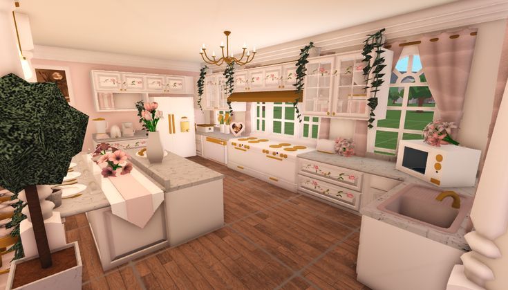 the kitchen is decorated in white and pink colors with gold trimmings on the walls