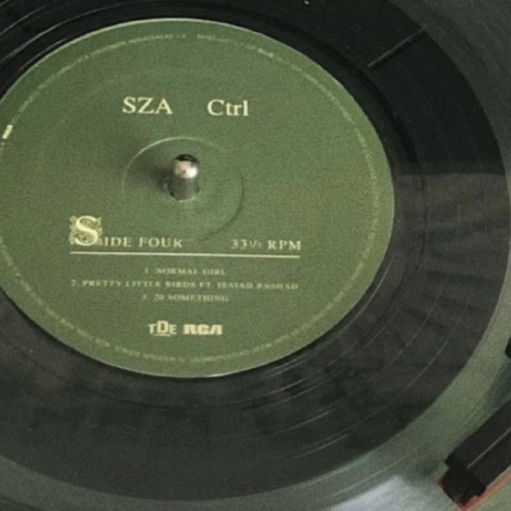 an old record with the name sza crt on it is sitting on a table