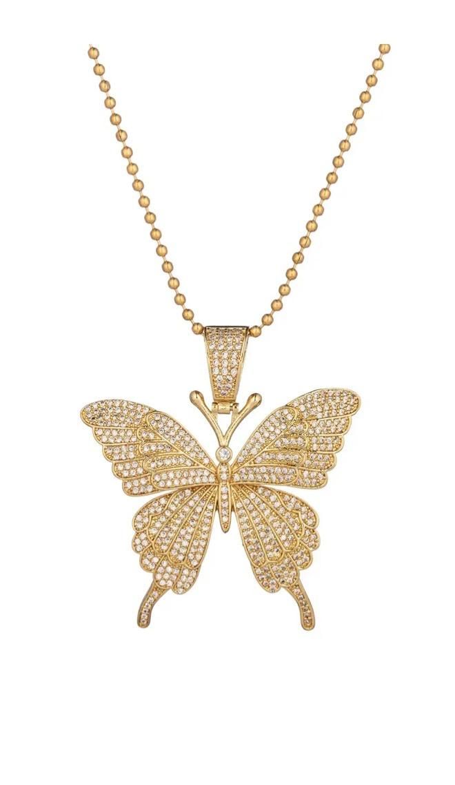 Let your jewelry set soar to new heights when you garner this stunning butterfly pendant necklace! Zirconia crystals dance around within this butterfly pendant to give the gold necklace a special glimmer. Coupled with the fact that this pendant sits on a unique beaded chain, this is a must have accessory for you! Product Details: Gold tone titanium CZ crystals Approx. 14" + 2" ext. length Clasp: lobster Big Butterfly Necklace, Crystal Jewelry With Butterfly Charm, Crystal Butterfly Charm Jewelry, Gold Crystal Butterfly Jewelry, Gold Butterfly-shaped Crystal Jewelry, Gold Plated Butterfly Pendant Necklace, Butterfly-shaped Crystal Jewelry For Gifts, Butterfly-shaped Crystal Jewelry Gift, Butterfly Shaped Crystal Jewelry For Gifts