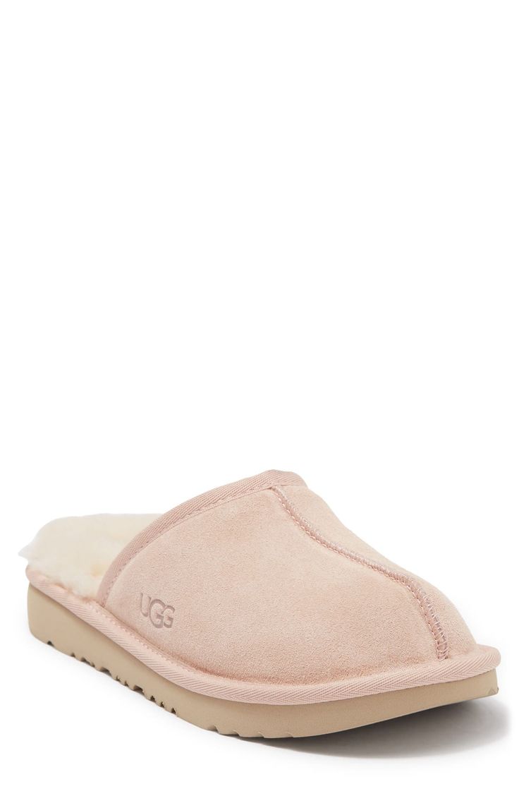 Cozy house slippers with an outdoor-friendly, sole done in a mini size for your little one. Slip-on Faux fur lining Leather upper, textile lining, synthetic sole Imported Slip On Slippers, Ugg Neumel, Bow Boots, Glitter Boots, Shearling Slippers, Ugg Classic Short, Shearling Boots, Kids Uggs, Ugg Classic