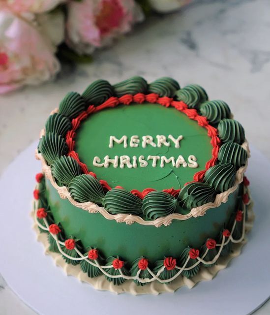 a merry christmas cake sitting on top of a table