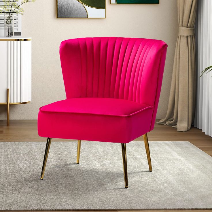 a pink chair sitting on top of a white rug