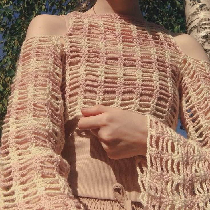 a close up of a person wearing a sweater