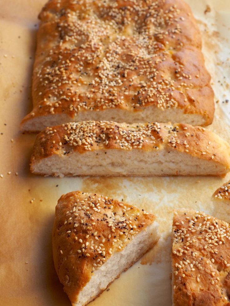 sliced loaf of bread with sesame seeds on top