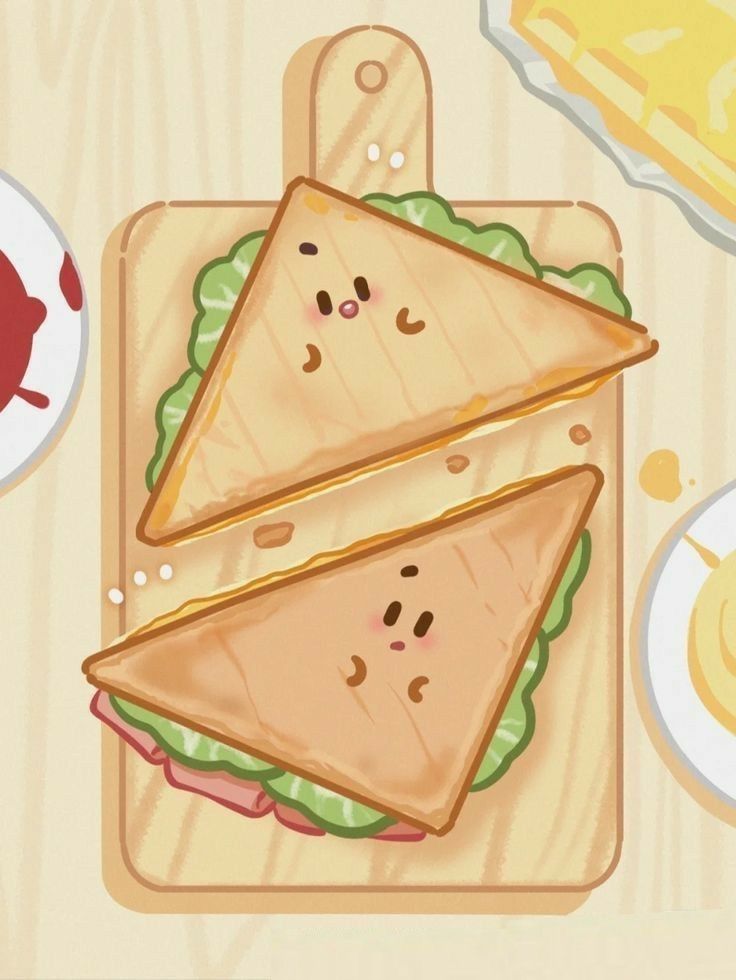 two slices of sandwich sitting on top of a cutting board