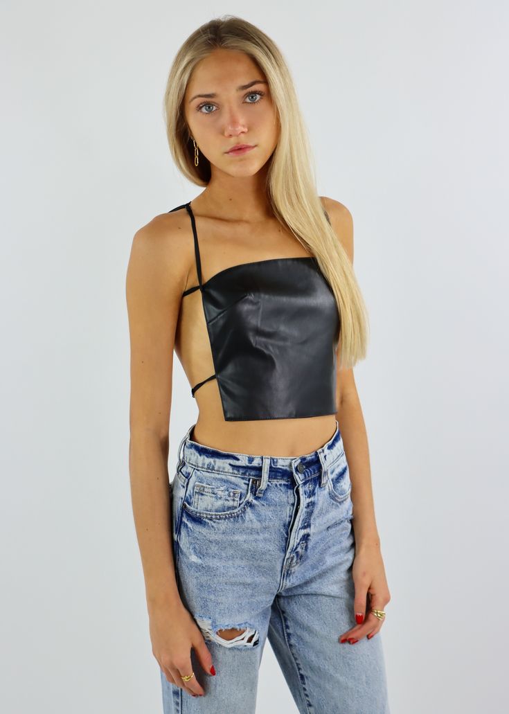 Raise a glass to your new favorite party top. This tube top features a faux leather material and a strappy open back. Wear this top to a dinner party with friends or to your next going-out event. Model Info Meet Sophie! Here she is wearing a size small. Hips: 36.5” | Waist: 25” | Bust: 30” | Height: 5’6” The Details Cropped Fit Faux Leather Open Back Adjustable Straps Hand Wash Cold, Line Dry Shell: 50% PU, 50% Polyester; Lining: 100% Polyester [#other] Hand wash in cold water Line dry [/other] Dinner Party With Friends, Tube Top Black, Small Hips, Party With Friends, Black Rock, Real Girls, Party Tops, Black Media, Tube Top