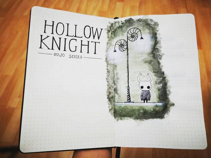 an open notebook with a drawing of a person holding a lamp post and the words hollow knight on it