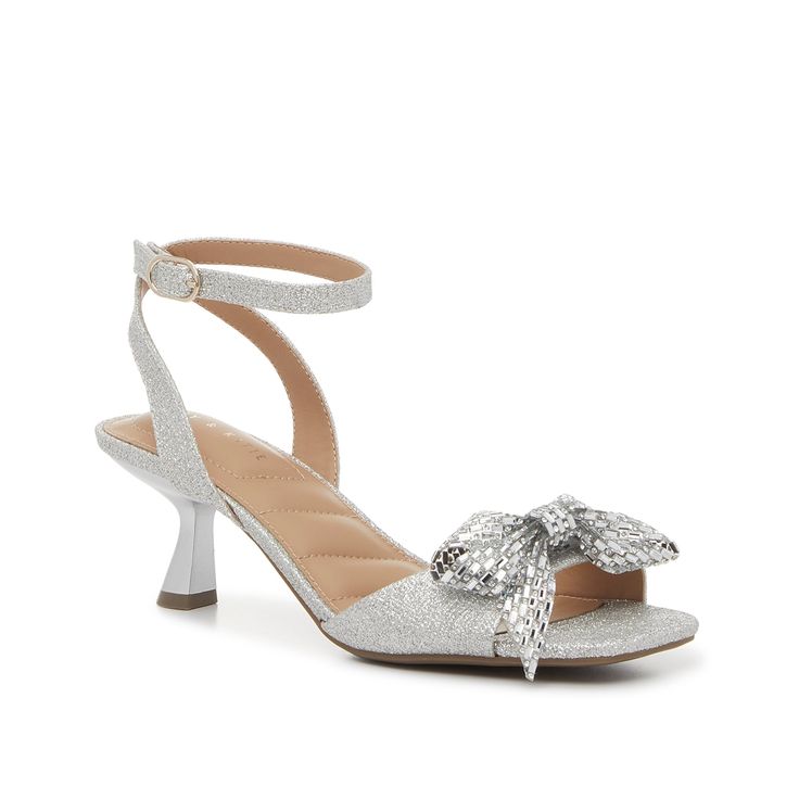 Kelly & Katie-Zaina Sandal You're sure to dazzle with this dainty style! The Zaina sandals from Kelly & Katie feature a classic silhouette, complete with trendy kitten heel and a modern square toe. Finished off with a rhinestone-covered bow that adds a sweet sparkle. Silver Kitten Heels With Heel Strap For Summer, Silver Low Heel Kitten Heels For Summer, Silver Kitten Heels For Summer, Silver Low Kitten Heels For Summer, Chic Silver Open Toe Kitten Heels, Elegant Silver Kitten Heels For Summer, Silver Ankle Strap Kitten Heels For Summer, Silver Ankle Strap Kitten Heels For Formal Occasions, Silver Ankle Strap Kitten Heels For Formal Events