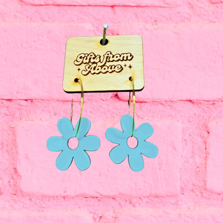 These pretty earrings are sure to catch attention and add a touch of whimsy to any outfit. Whether you choose gold or silver hoops, the Daisy Hoop Earrings are a delightful addition to your jewelry collection! 🌼💫 Trendy Handmade Small Hoop Earrings, Spring Trendy Dangle Hoop Earrings, Trendy Flower Earrings As Gift, Trendy Spring Dangle Hoop Earrings, Trendy Dangle Hoop Earrings For Spring, Blue Hoop Earrings For Spring Gift, Playful Handmade Hoop Jewelry, Trendy Nickel-free Dangle Flower Earrings, Trendy Blue Small Hoop Earrings