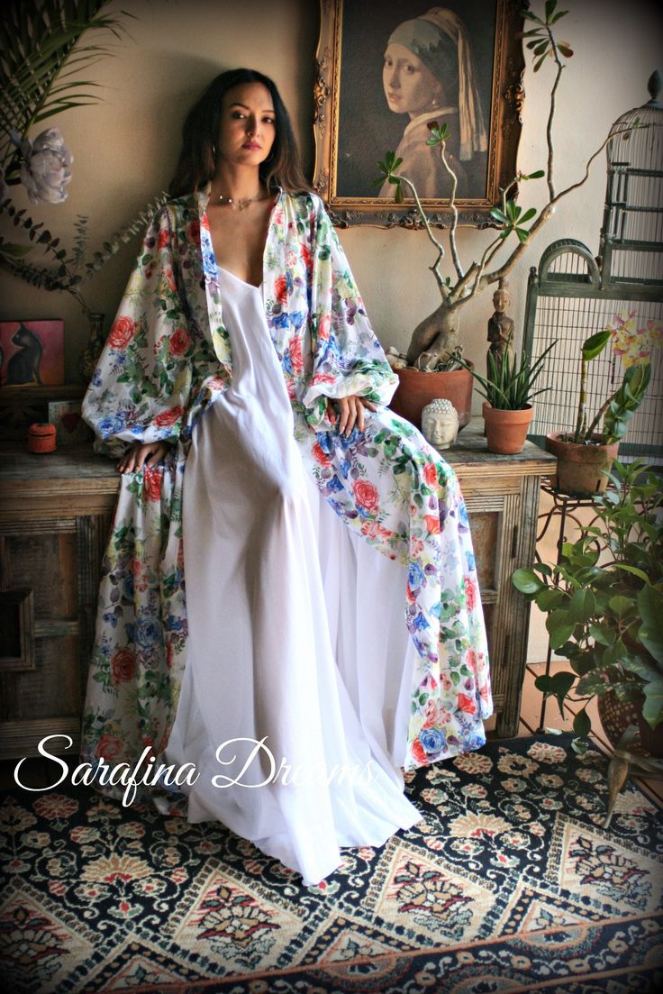 "100% cotton in the prettiest floral print for Spring/Summer. Finally back to Spring weddings, Cruises, destination weddings and spa days, this is the perfect pretty piece to add to your summer collection. This cotton is the softest against the skin, washes beautifully without the usual wrinkling and is light weight. Wrap robe styling with side inseam pockets (a must), super full puff sleeves with banded finish and a tie sash belt. Cooler for the summer heat to have a fuller sleeve and this cott Summer Cotton Nightgown For Wedding, Cotton Summer Nightgown For Weddings, Cotton Nightgown For Summer Weddings, Summer Cotton Wedding Nightgown, White Bohemian Nightgown For Loungewear, White Wedding Nightgown For Spring, White Spring Wedding Nightgown, Spring Wedding White Nightgown, Bohemian White Sleepwear For Daywear