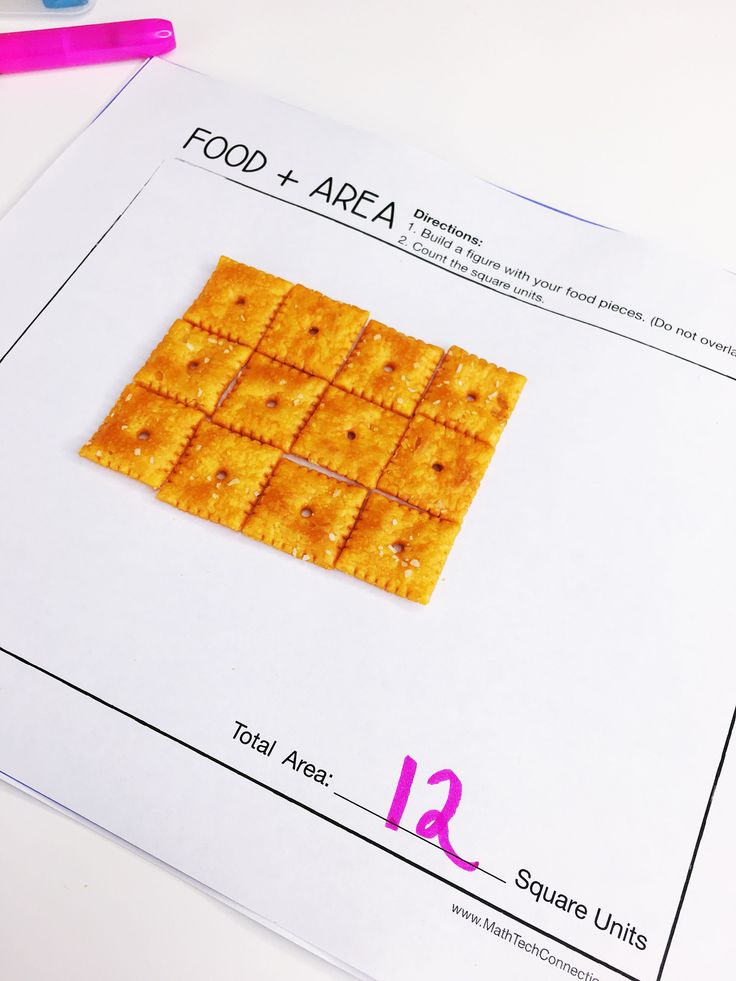 crackers are arranged in the shape of squares on top of a sheet of paper