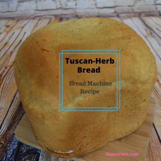 a loaf of bread sitting on top of a cutting board with the words tuscan - herb bread