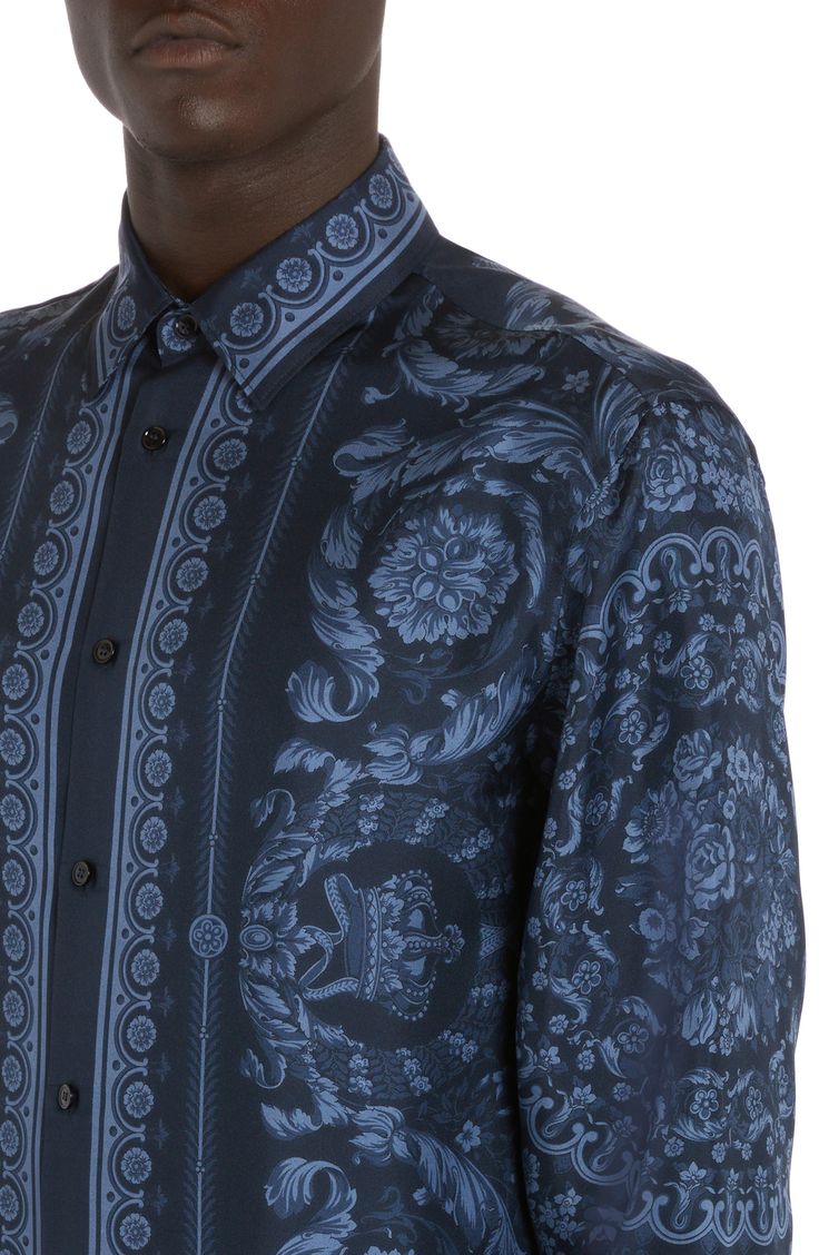 Ornate filigree brings Versace's quintessential baroque glamour to a shirt crafted in Italy from polished silk. 30" length (size 38 US / 48 EU) Front button closure Point collar Long sleeves with button cuffs 100% silk Dry clean Made in Italy Designer Clothing Designer Silk Shirt With Spread Collar, Luxury Long Sleeve Silk Shirt, Luxury Blue Long Sleeve Shirt, Luxury Long Sleeve Blue Shirt, Luxury Silk Tops With Spread Collar, Luxury Silk Top With Spread Collar, Luxury Formal Tops With Covered Buttons, Blue Silk Luxury Tops, Luxury Blue Silk Tops