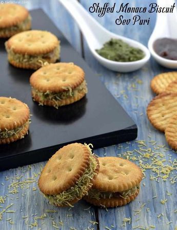 small crackers are arranged on a cutting board