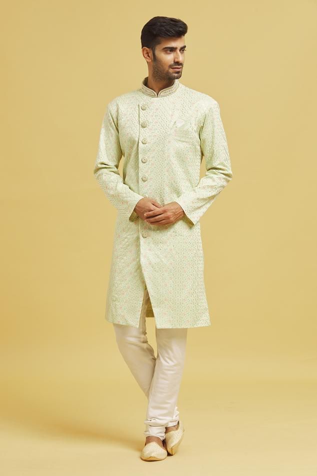 Pista sherwani with thread embroidered jaal motifs. Comes with churidar.
Components: 2
Pattern: Embroidered
Type Of Work: Floral
Neckline: Mandarin Collar
Sleeve Type: Full
Fabric: Sherwani: Jaquard Chikankari Lucknawi, Churidar: Silk Dupion
Color: Green
Other Details: 
Closure:
Sherwani: Button
Churidar: Drawstring
Note: Pocket square worn by model is not for sale
Occasion: Mehendi and Puja,Sangeet - Aza Fashions Ceremonial Pista Green Sherwani With Cutdana, Pista Green Bandhgala With Cutdana For Ceremonial Occasions, Pista Green Traditional Wear With Zari Work In Jamawar, Traditional Pista Green Bandhgala For Ceremonial Occasions, Traditional Pista Green Ceremonial Bandhgala, Eid Brocade Sherwani With Chikankari Embroidery, Traditional Pista Green Bandhgala Straight Kurta, Wedding Unstitched Naqshi Suit In Pista Green, Ceremonial Pista Green Bandhgala With Zari Work