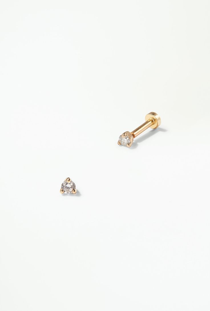 A brilliant white diamond set in 14k gold — the perfect accent to a curated ear. Our threadless flat back studs are super comfortable and make it easy to wear all day everyday. 14k solid recycled yellow gold 14k white gold post Diamonds: 2mm, 0.03ct per earring, reclaimed Flat Backing: 14k yellow gold, 1.0mm diameter (18ga) Flat Backing Length: available in either 5mm or 7mm length These backings are exclusively for WWAKE flat-back earrings, and won't work for other WWAKE earrings Wwake Earrings, Curated Ear, Flat Back Earrings, All Day Everyday, Studded Flats, Pearl Diamond, Earring Sale, Diamond Stud, Diamond Set