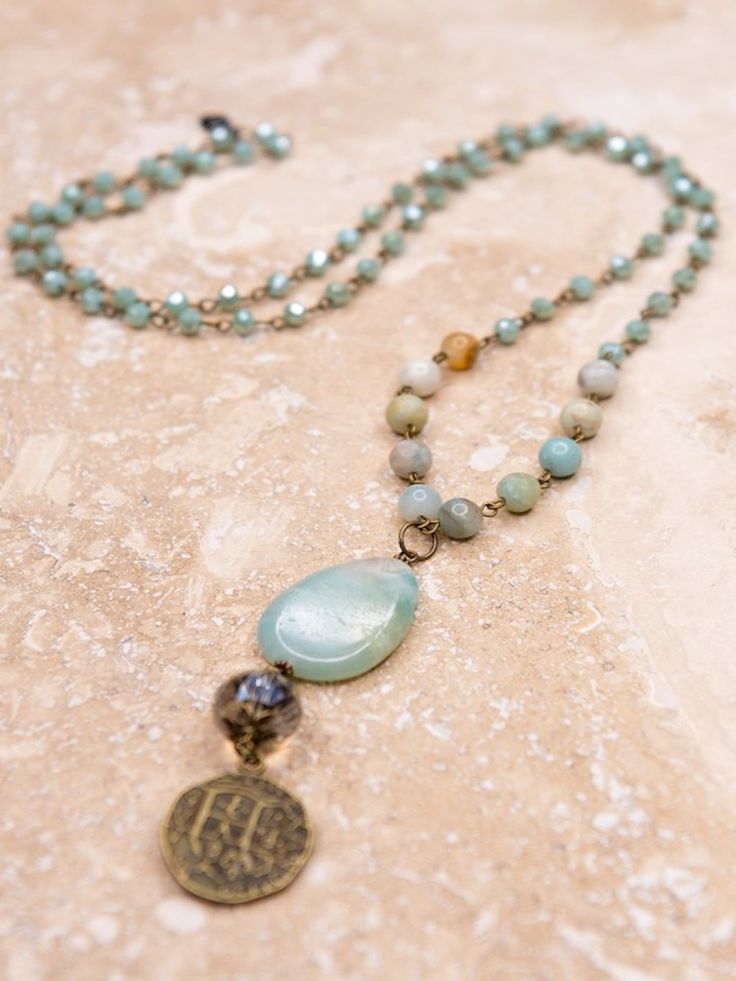 You will absolutely love this necklace! Long, skinny necklace with beautiful natural stones and beads on a chain link. Includes a long charm which includes a doubloon coin, a crystal bead with floral bead ends and a polished agate stone. Stones may differ Please expect some variation in color and/or texture nickel/lead compliant Boutique Clothing Store, Amazonite Necklace, Long Beaded Necklace, Beaded Crafts, Necklace Long, Classic Jewelry, Women's Boutique, Jasper Beads, Hand Made Jewelry