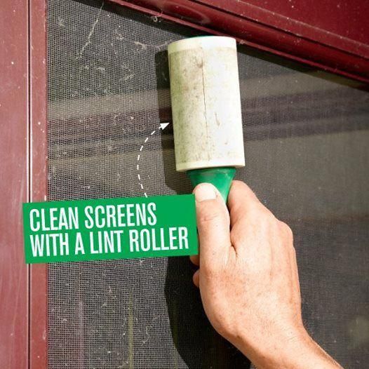 a hand holding a green and white sign that says clean screens with a lint roller