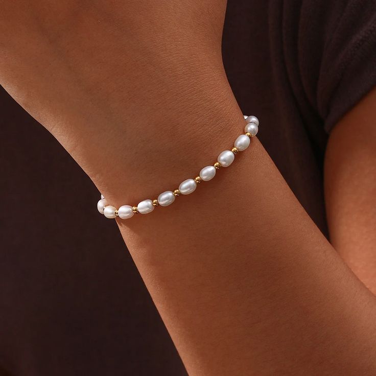 Waterproof/tarnish free Material Quality: Crafted from 18k gold-finished stainless steel for durability and a lasting shine. Pearls: Adorned with genuine freshwater pearls, each unique in shape and luster. Adjustable Design: Features an adjustable chain for a custom fit, ensuring comfort and versatility for all wrist sizes. Elegantly designed, this stunning Pearl Bracelet marries the lustrous charm of real freshwater pearls with the durability and shine of 18k gold-finished stainless steel. This piece is a testament to timeless style, perfectly blending classic allure with contemporary craftsmanship. Whether worn for a sophisticated evening or a casual day out, it offers a touch of luxury to any outfit, making it an essential addition to any jewelry collection. Color Beads, Freshwater Pearl Bracelet, Waterproof Jewelry, Gold Plated Bracelets, Bracelet Crafts, Steel Chain, Stainless Steel Chain, Pearl Bracelet, Luxury Jewelry