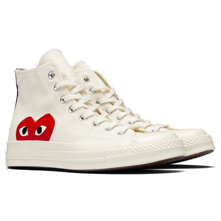 The iconic collaboration between Converse and Comme Des Garçons PLAY continues with the All Star Chuck ‘70 Hi. The traditional Converse silhouette features the signature bug-eyed red heart motif throughout the exterior. The silhouette is complete with a full-lace closure, and a rubber toebox and outsole for extended durability. CHUCK TAYLORS RUN ABOUT 1/2 SIZE LARGE, WE RECOMMEND SIZING DOWN. THIS PRODUCT DOES NOT QUALIFY FOR ANY DISCOUNTS OR SPECIAL PROMOTIONS. Canvas upper Printed CDG heart lo Heart Converse, Converse X Comme Des Garcons, Comme Des Garcons Shoes, Converse Comme Des Garcons, Converse Play, Obx Dr, Doodles Ideas, Garcons Converse, Comme Des Garcons Converse