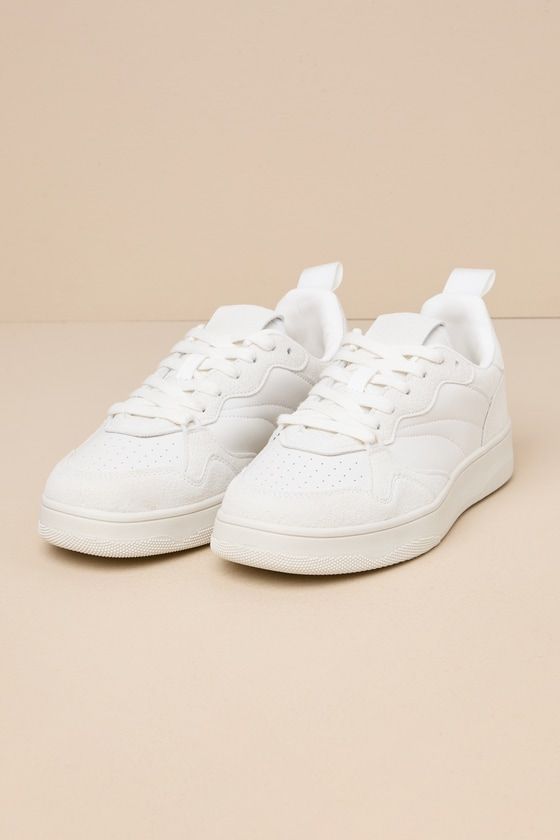 Bring a cute and sporty vibe to all your everyday looks with the Lulus Mezereon White Sneakers! Smooth faux leather and soft faux suede come together to form these cute sneakers that have a round toe with perforated accents and a vintage-inspired design. Lace-up vamp and pull tab at back. Bumper sole completes the look. Available in Euro sizing only. 1" bumper sole. Lightly cushioned insole. Rubber sole has nonskid markings. Man made materials. Imported. Lulus | Mezereon White Sneakers | Size 40 Trendy Low-top Platform Sneakers With Perforations, Everyday Lace-up Sneakers With White Laces, Trendy High-top Sneakers With Perforations, Trendy Platform Sneakers With Perforated Toe Box For Sports, Trendy Synthetic Sneakers For Everyday, Trendy Lace-up Platform Sneakers With Perforations, Trendy Synthetic Everyday Sneakers, Sporty Platform Sneakers With Speckled Midsole, Trendy Platform Sneakers With Perforations