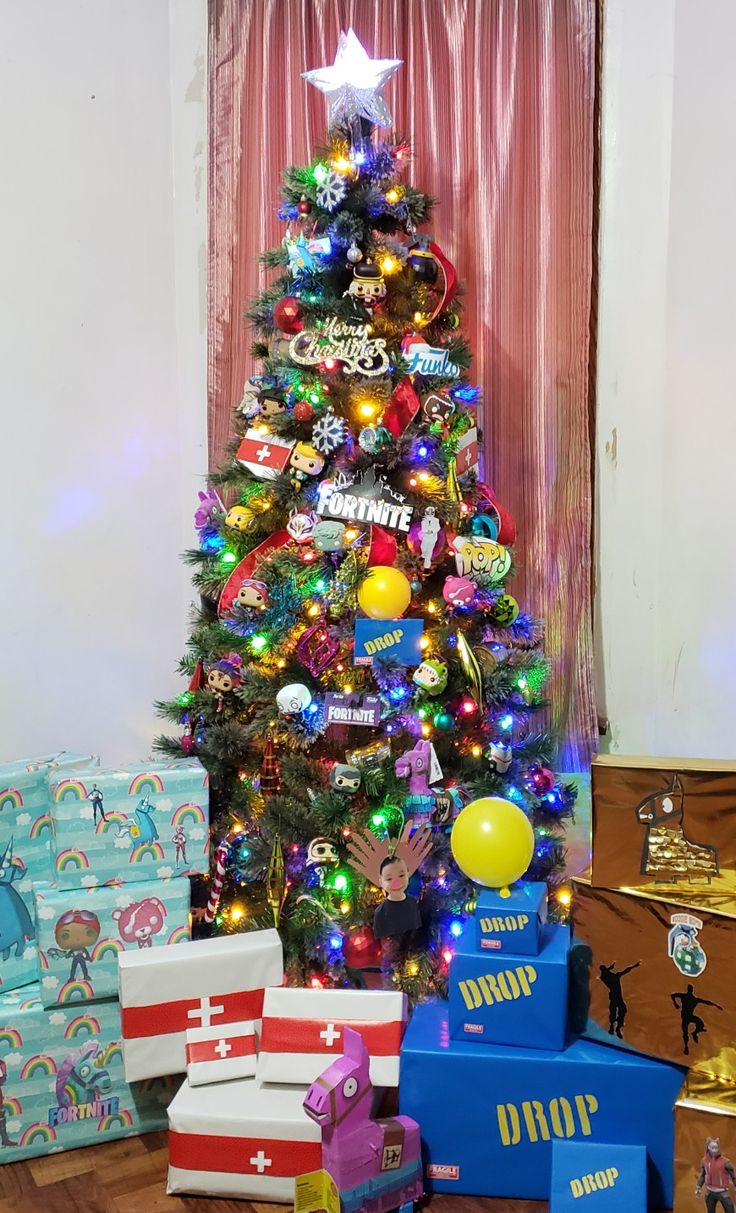 a brightly colored christmas tree surrounded by presents