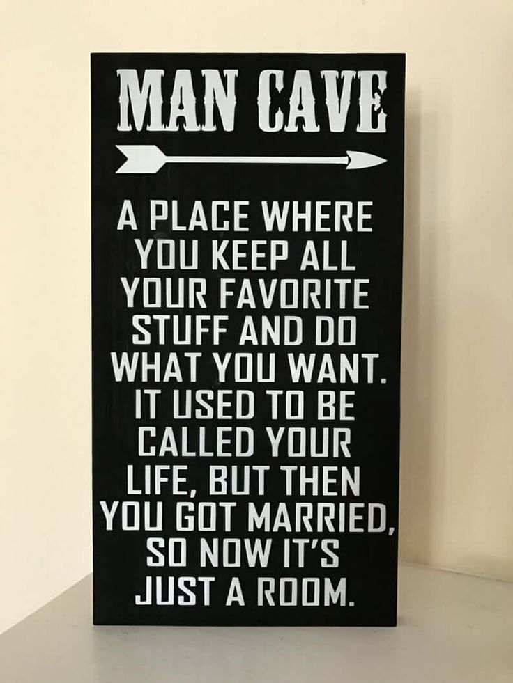 a black and white sign that says man cave