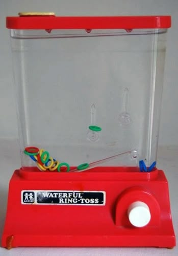 a red toy machine sitting on top of a table