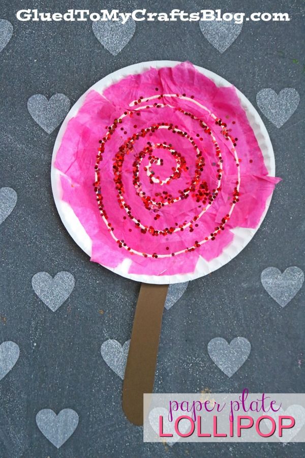 a paper plate lollipop with hearts on it