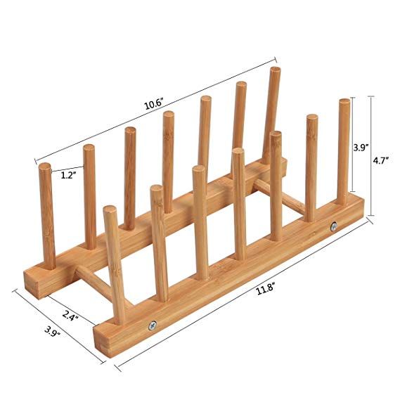 a wooden rack with four pegs on it and measurements for the top two are shown