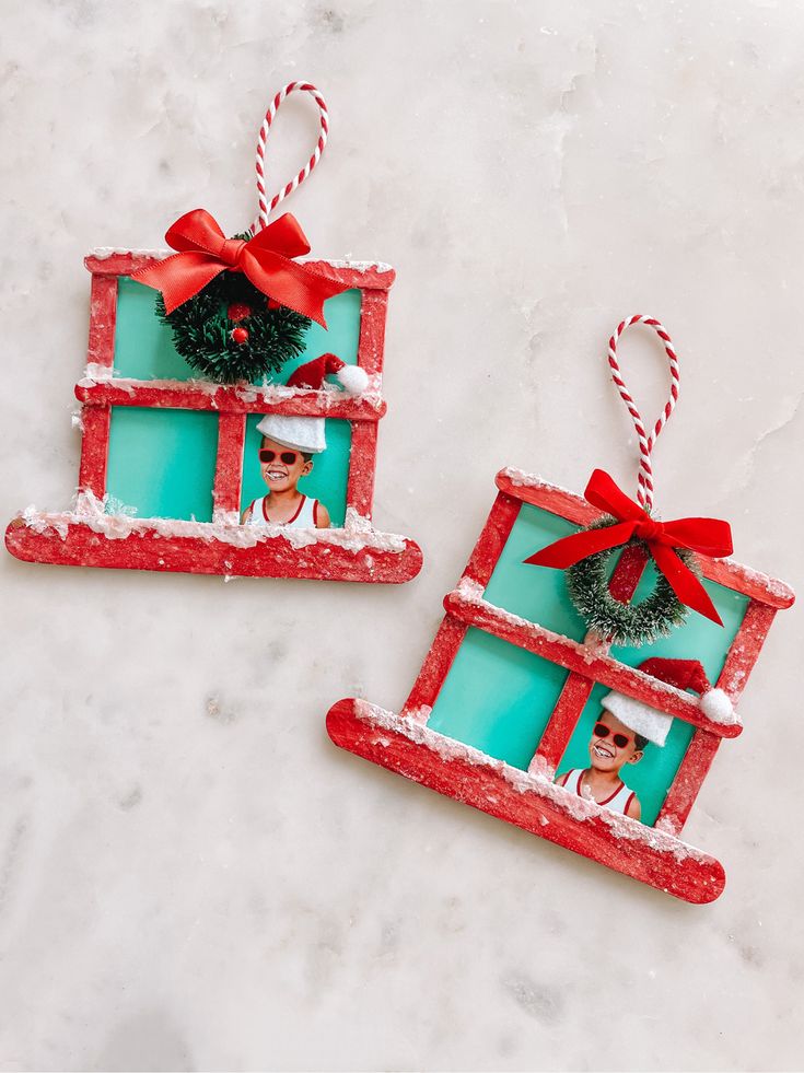 two christmas ornaments made to look like frames