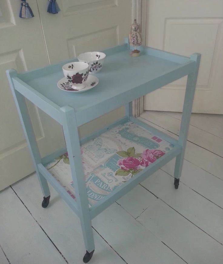 a blue table with two cups on it