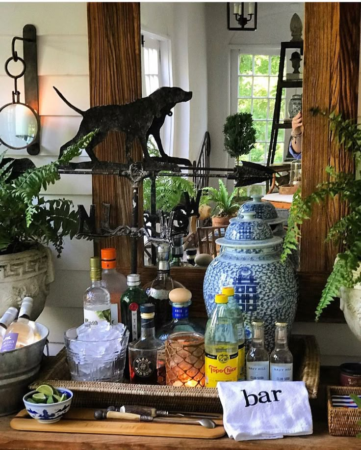 an assortment of bottles and vases on a table