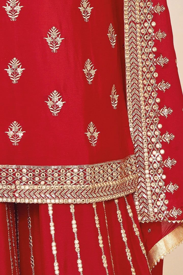 This Red Chinon Silk Embroidered Palazzo Salwar Suit is a fine choice for traditional wedding parties and special occasions such as Karwa Chauth. It features Mirror Effect, Zari and Sequins Work and is designed with a Round Neck and Full Sleeves. Also included is a Red Chinon Chiffon Palazzo and a matching Red Chinon Chiffon Dupatta. Its eye-catching red hue and heavy embroidery make it an extraordinary ensemble. 3 piece Kameez chinon silk with heavy embroidery mirror zari & sequin work Palazzo Traditional Red Palazzo Set For Celebration, Red Traditional Drape Palazzo Set For Celebration, Red Palazzo Set For Celebration With Traditional Drape, Traditional Wedding Palazzo Set With Dori Work, Red Palazzo Set For Celebration, Elegant Red Palazzo Set With Intricate Embroidery, Red Chinon Salwar Kameez For Transitional Season, Red Palazzo Set With Intricate Embroidery And Traditional Drape, Red Straight Kurta Sharara For Traditional Ceremonies