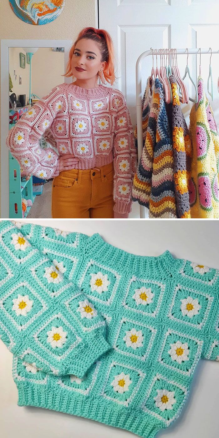 a woman standing in front of a rack with crocheted sweaters on it