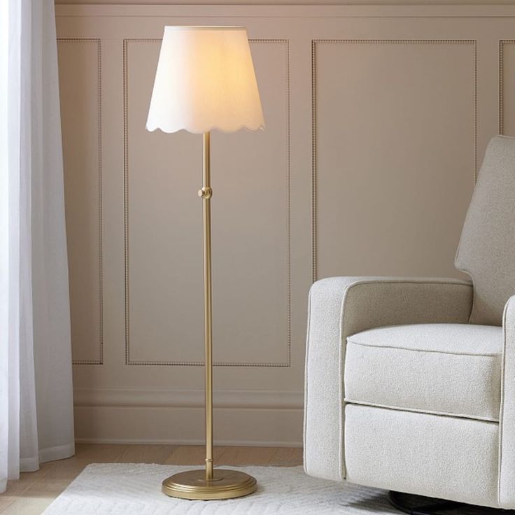 a living room with a chair and lamp