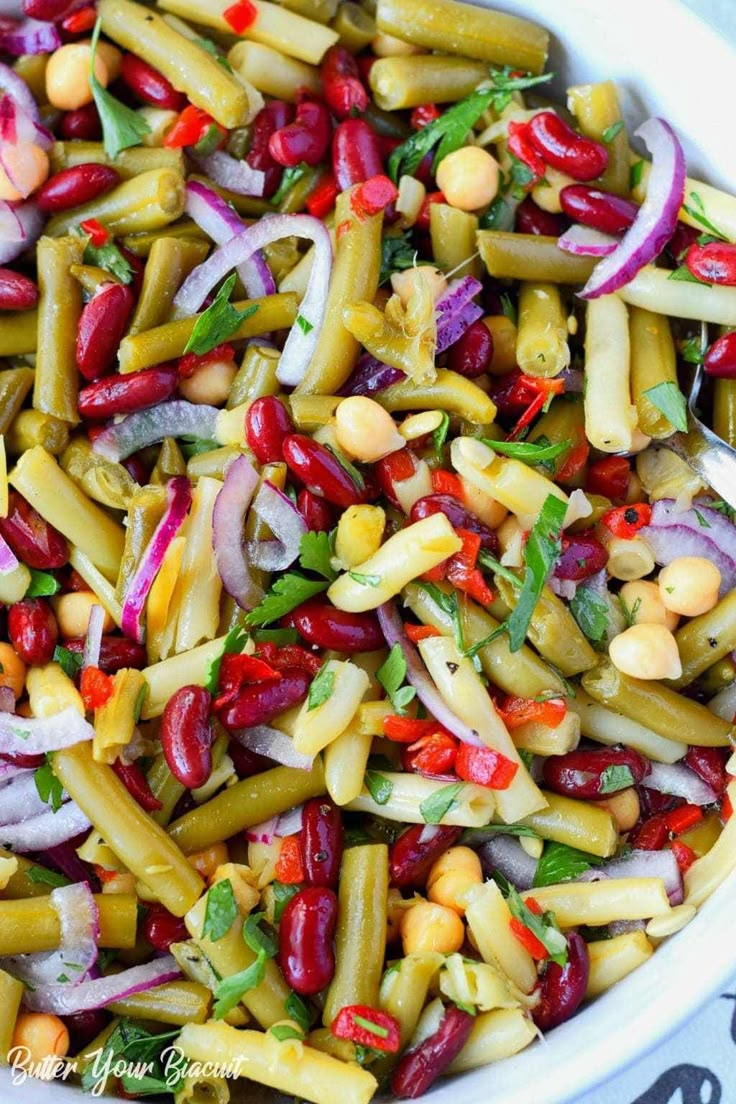 a white bowl filled with beans and veggies