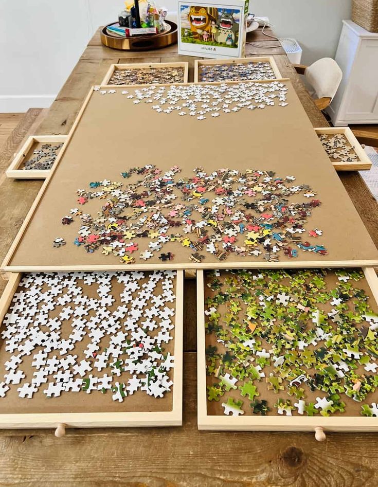 several pieces of puzzle sitting on top of a wooden table