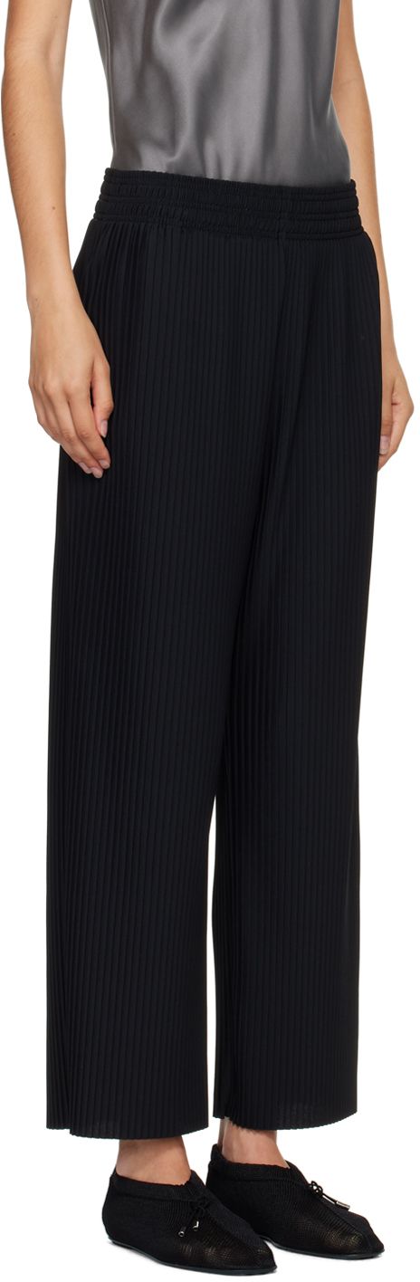 Garment-pleated stretch polyester crepe pants. · Elasticized waistband · Two-pocket styling Supplier color: Black Black Pleated Bottoms For Workwear, Black Pleated Pants For Work, Black Pleated Wide Leg Pants For Work, Chic Black Bottoms With Accordion Pleats, Black Pleated Bottoms For Business Casual, Formal Black Bottoms With Accordion Pleats, Black Pleated Tapered Leg Pants, Black Non-stretch Pants With Elastic Waistband, Black Moisture-wicking Pants