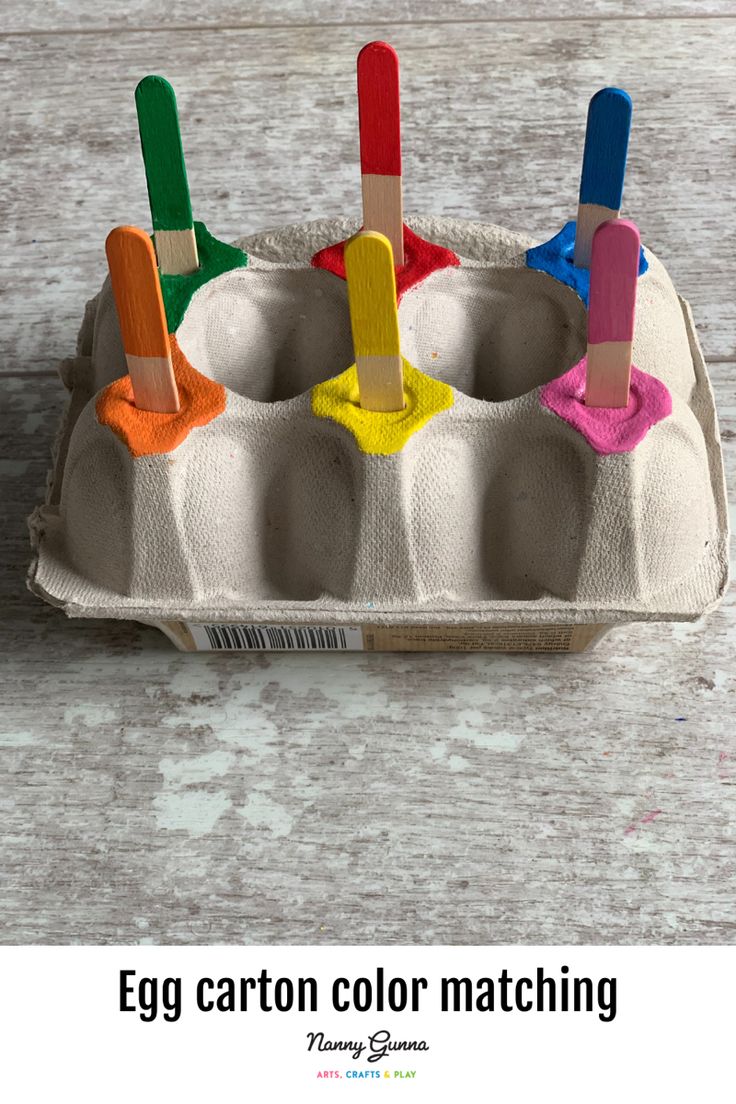 an egg carton color matching game with popsicles in it and text overlay that says egg carton color matching