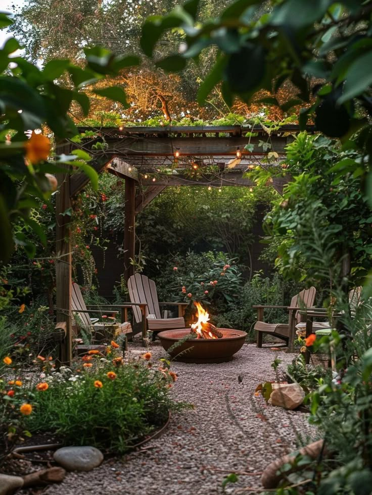 an outdoor fire pit surrounded by chairs and trees