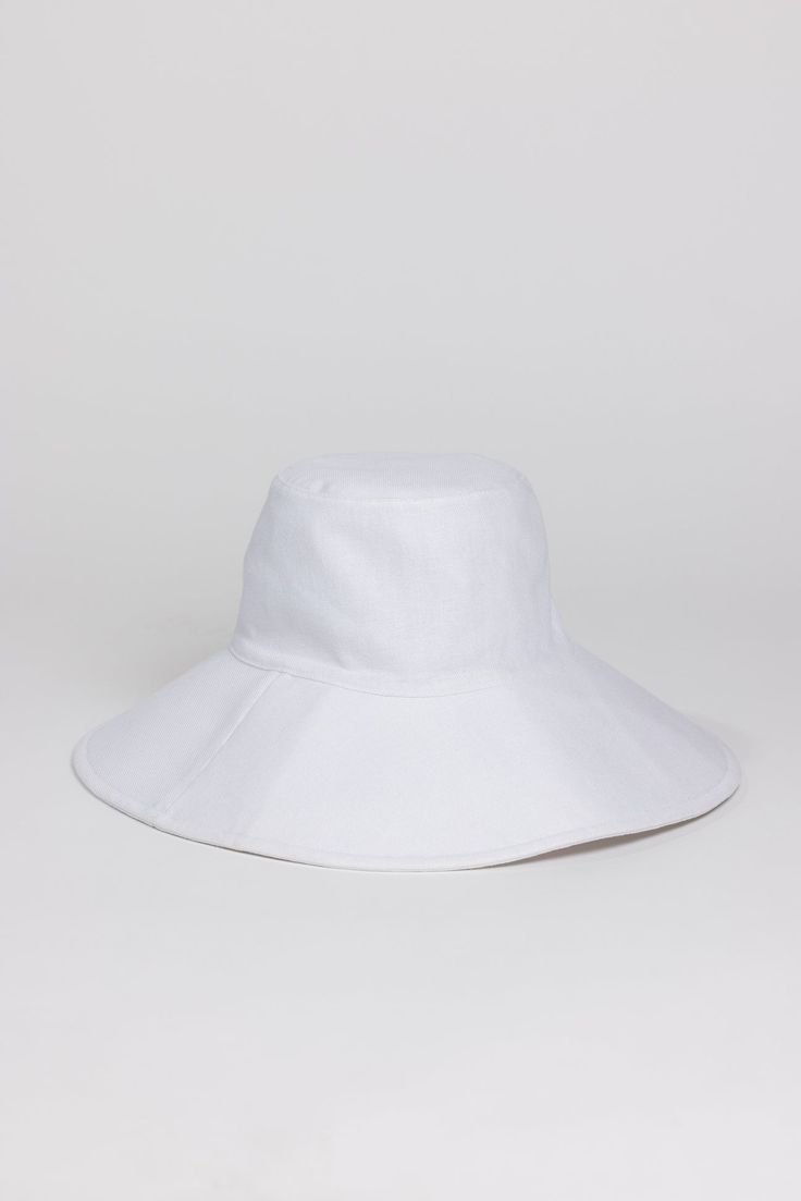 Our Simple Sunhat is both classic and trendy. It has built in SPF protection and easily your go to for blocking those sunny rays. Material: Shell- 55% Linen 45% Cotton, Lining- 100% Cotton Measurements: Crown Height- 3.5", Brim- 4.5", Head Measurement is 57cm White Cotton Brimmed Sun Hat, Casual White 5-panel Sun Hat, White Flat Brim Sun Hat, One Size Fits Most, White Sun Hat For Spring, One Size, White One-size Bucket Sun Hat, Packable Sun Hat, Custom Embroidered Hats, Winter Guard, White Hat