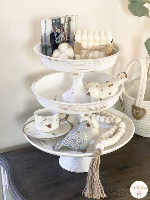 a three tiered tray with various items on it